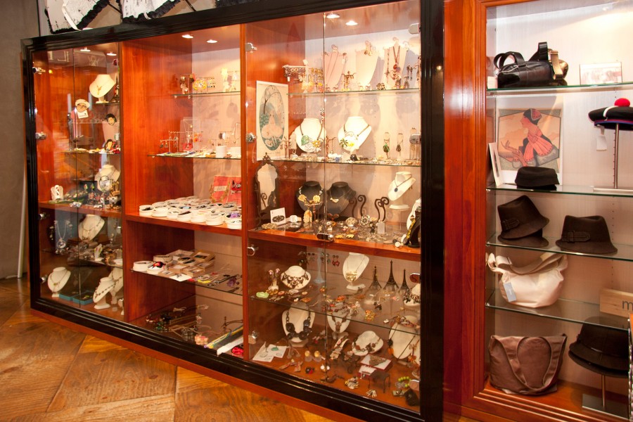 Glass-fronted retail display cabinet with timber shelving, custom built for Sine Qua Non jewellery store